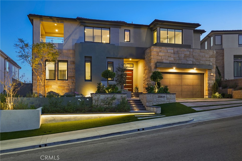 20414 Windsor Lane Porter Ranch, CA 91326 - Photo 1 of 2 a front view of a house with a yard