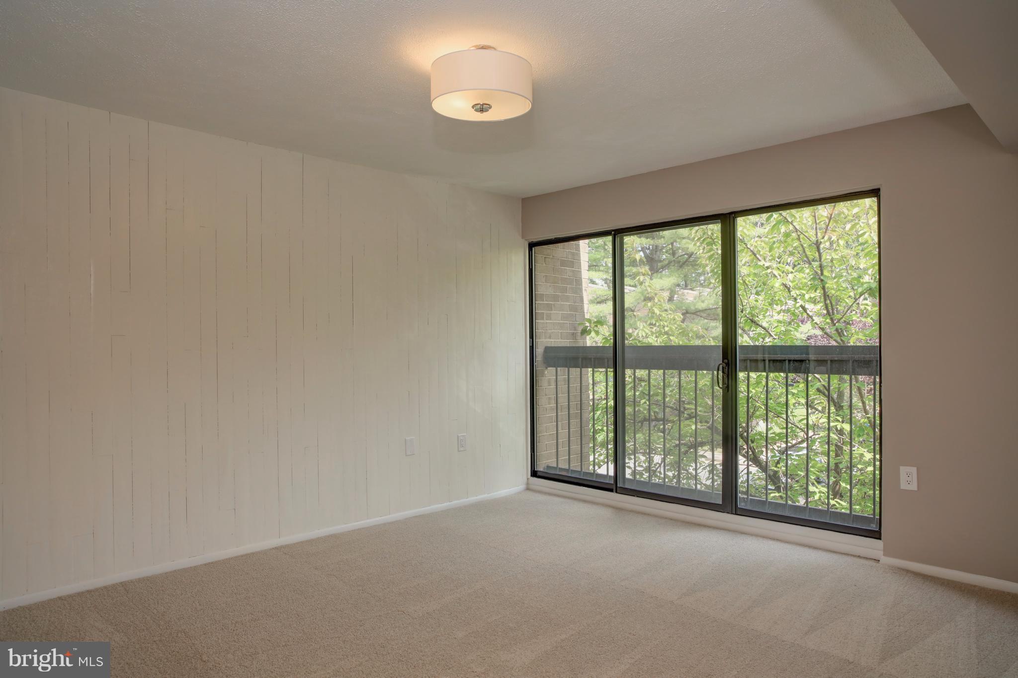 11616 Ivystone Court, Unit 301 Reston, VA 20191 - Photo 16 of 29 an empty room with windows and city view