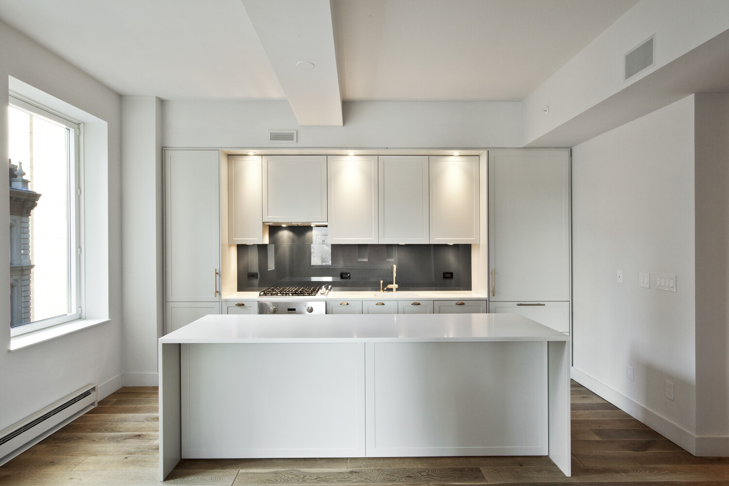 a bathroom with a sink a mirror and a window