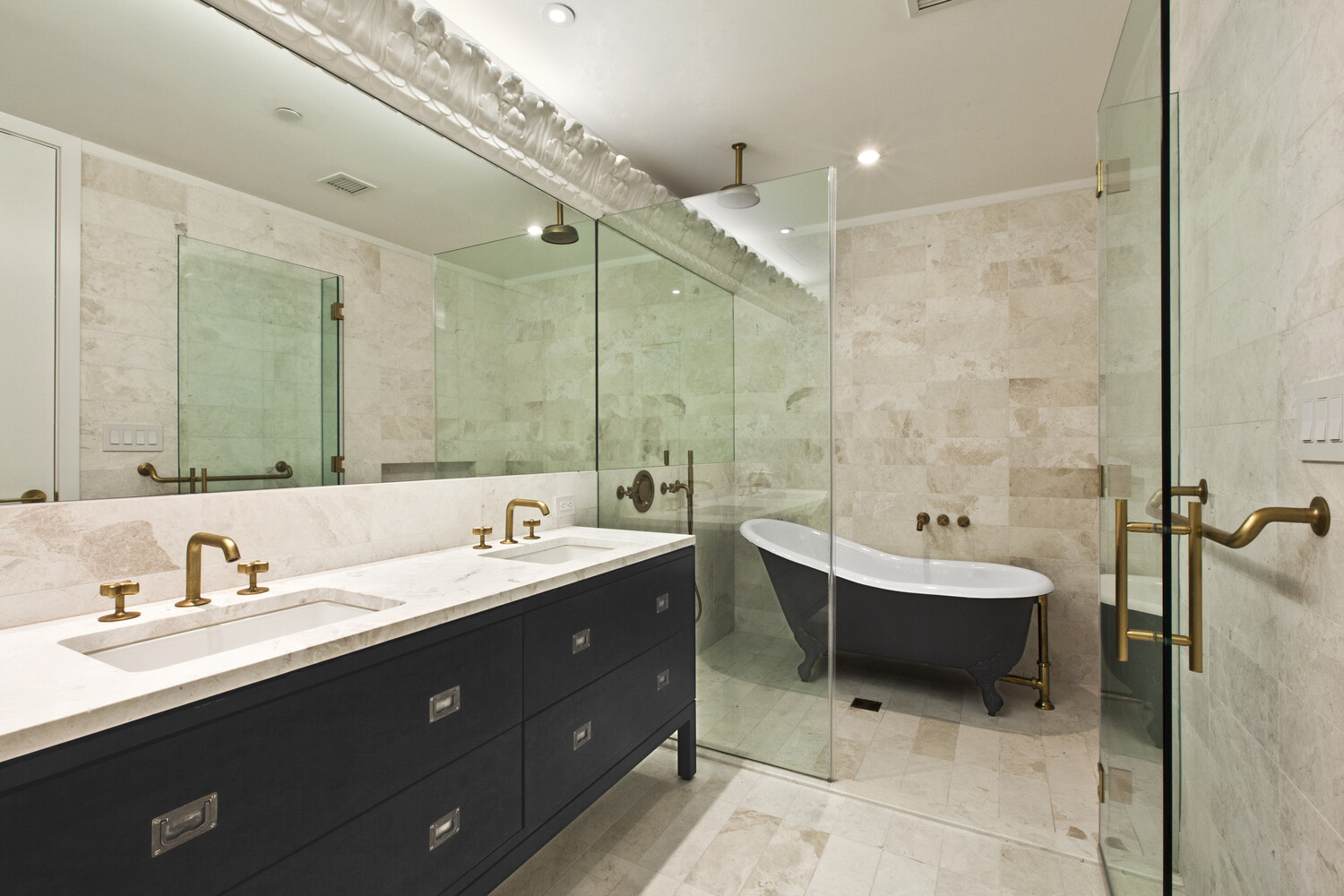 93 Worth Street, Unit 602 Manhattan, NY 10013 - Photo 4 of 8 a bathroom with a double vanity sink mirror and bathtub
