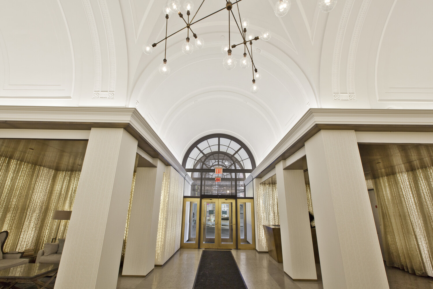 93 Worth Street, Unit 602 Manhattan, NY 10013 - Photo 7 of 8 a view of a hallway with wooden floor and staircase