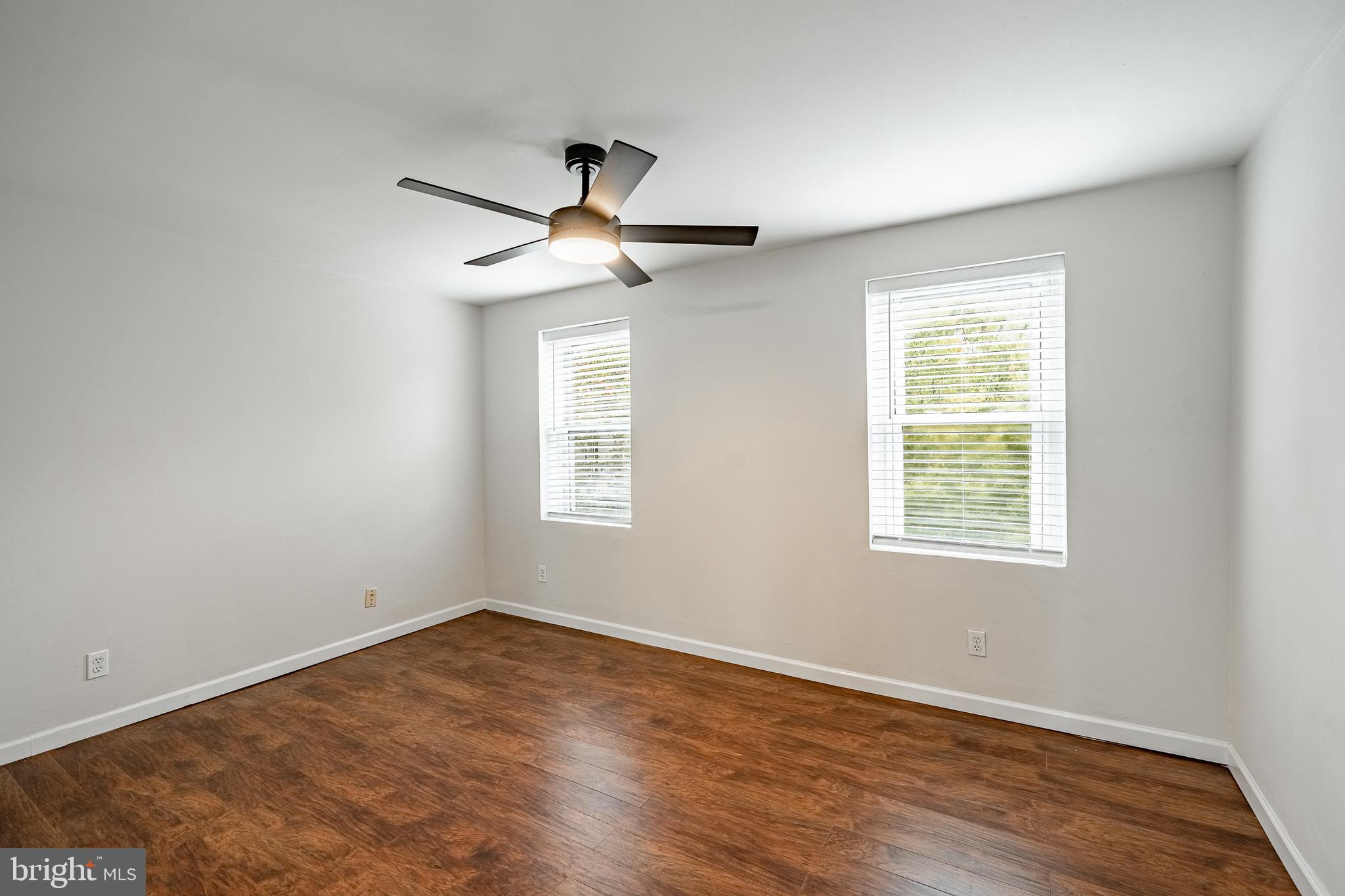 841 Perkiomen Street Philadelphia, PA 19130 - Photo 11 of 23 a view of an empty room with wooden floor and a window