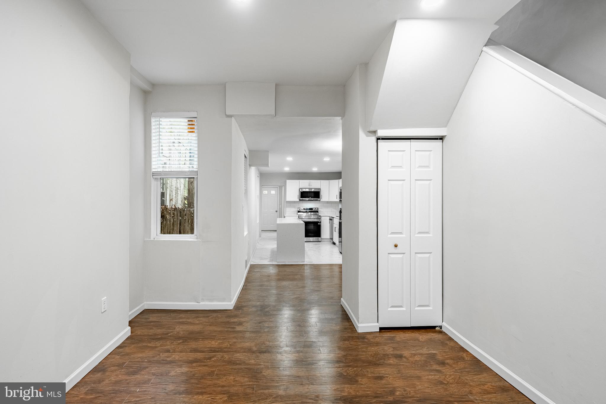 841 Perkiomen Street Philadelphia, PA 19130 - Photo 4 of 23 a view of a hallway with wooden floor and a bathroom