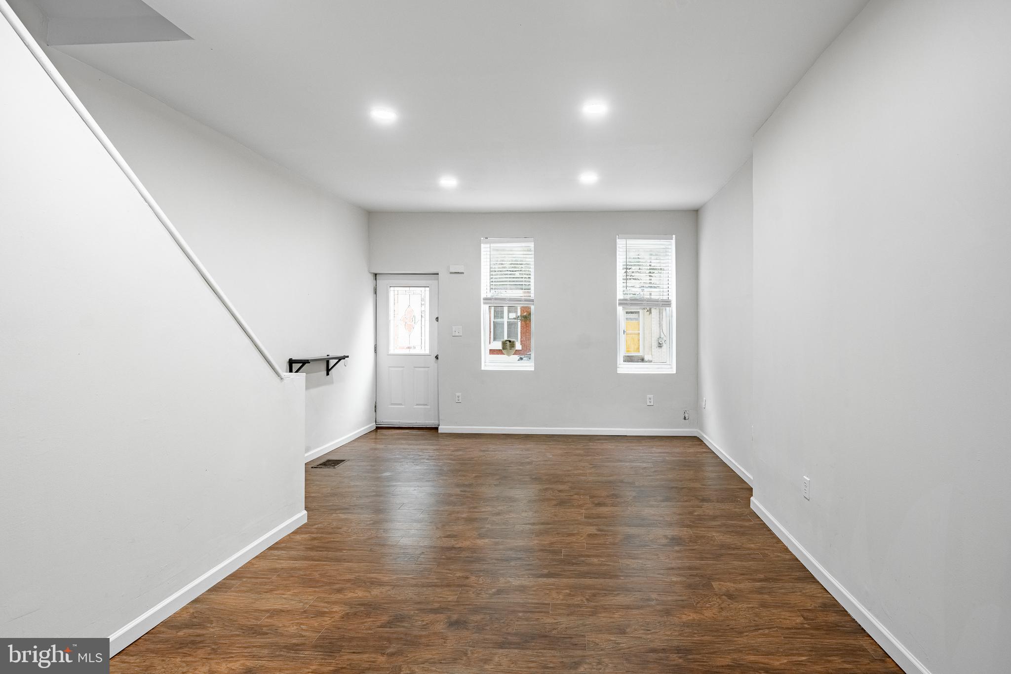 841 Perkiomen Street Philadelphia, PA 19130 - Photo 5 of 23 an empty room with wooden floor and windows
