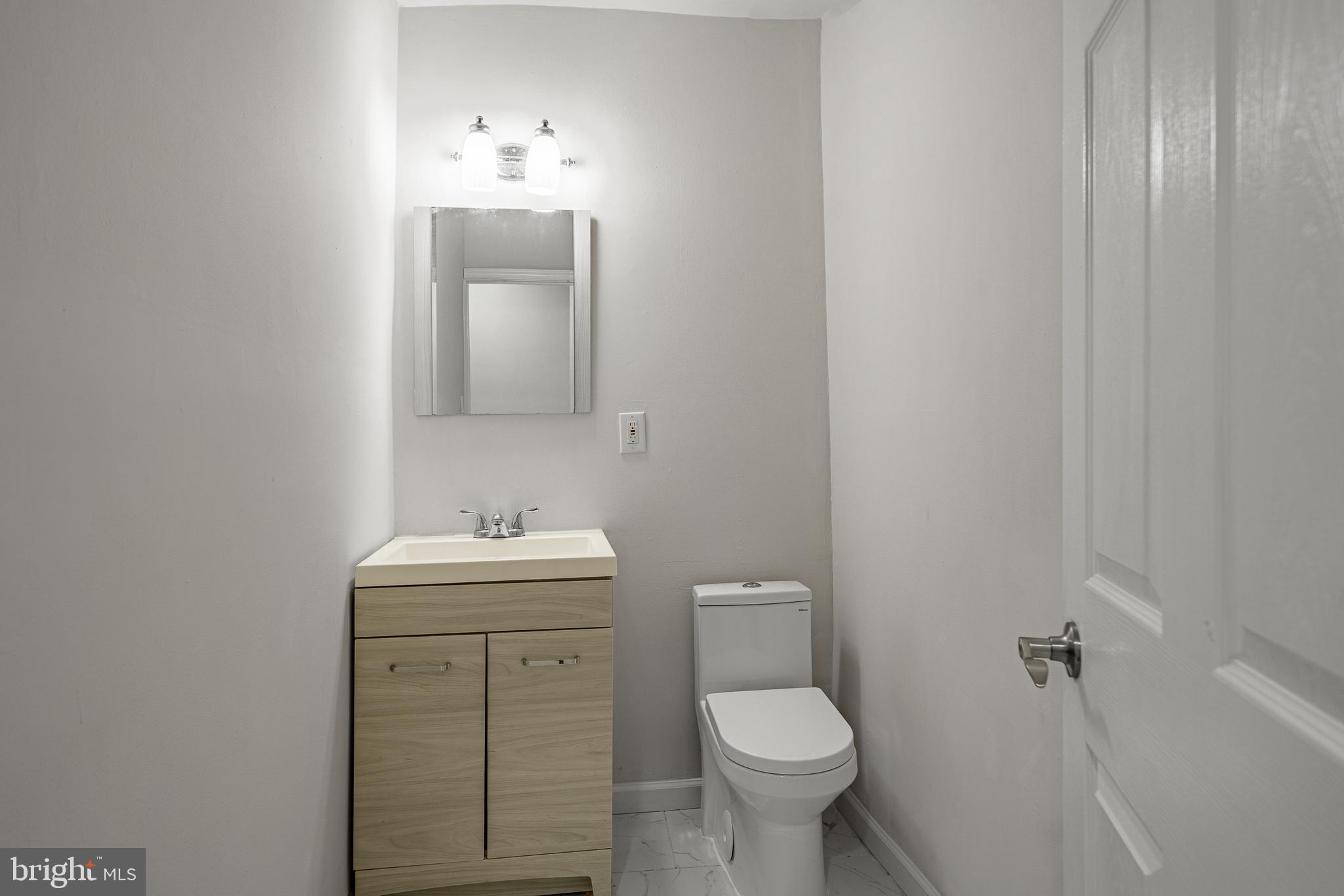 841 Perkiomen Street Philadelphia, PA 19130 - Photo 10 of 23 a bathroom with a sink toilet and mirror