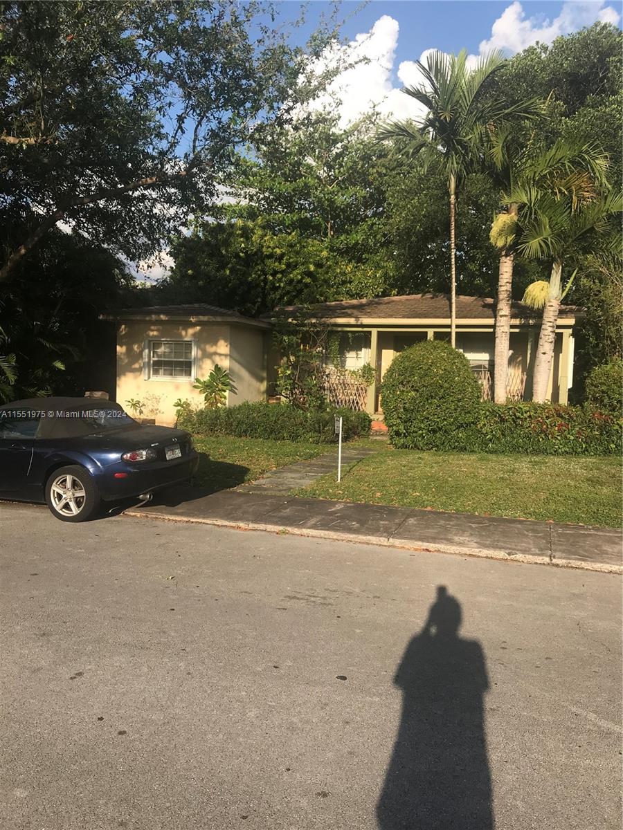 905 Tangier Street Coral Gables, FL 33134 - Photo 3 of 4 a view of a street