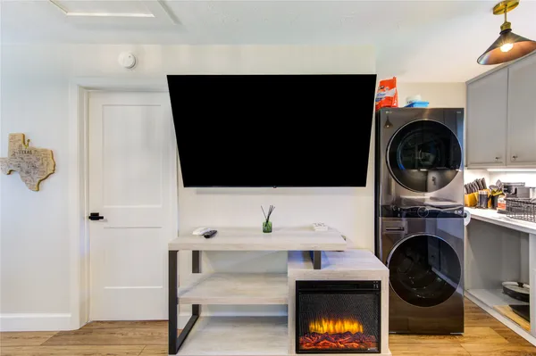 a view of a room with wooden floor and outdoor seating