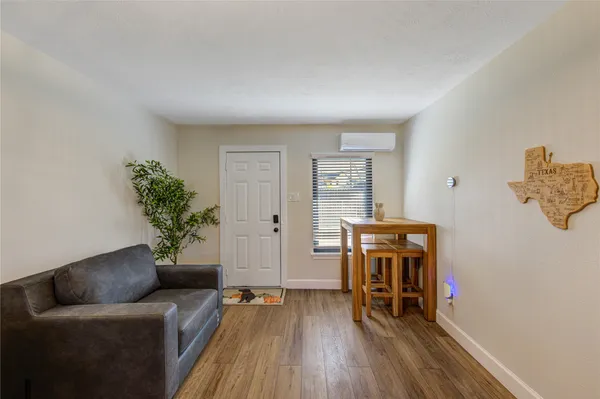 a building outdoor space with patio furniture and potted plants