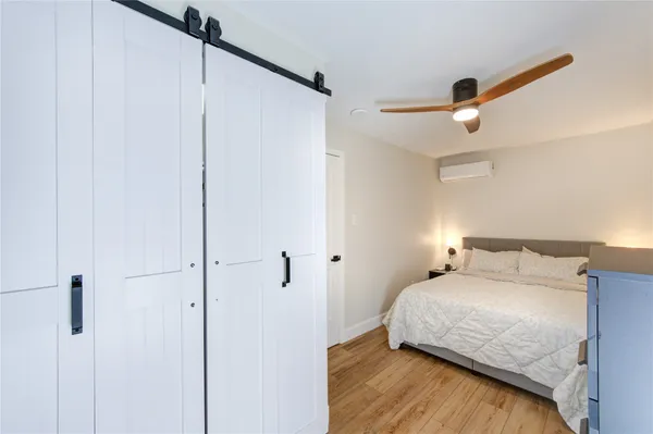 a view of a room with furniture and wooden floor