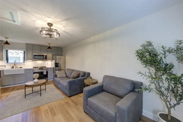 a bedroom with a bed and a ceiling fan