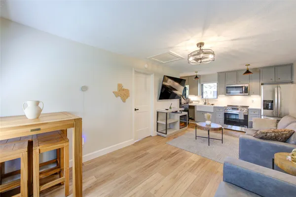 a bedroom with a bed and a ceiling fan