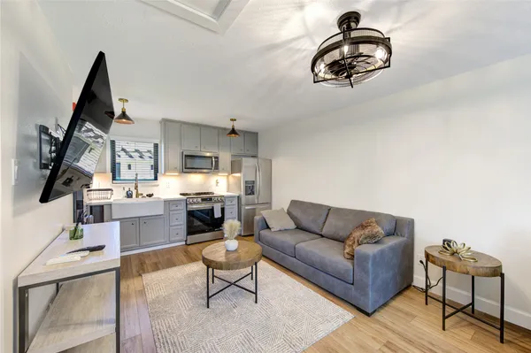 a bedroom with a bed and a potted plant