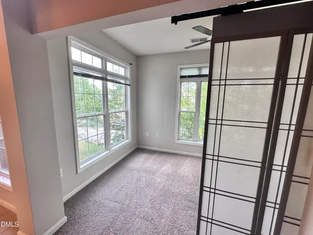 an empty room with windows