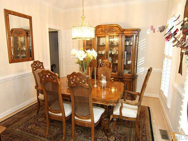 The formal dining room features chair rail which continues through most of the first floor. Hardwoods grace the main floor living. Dining Room