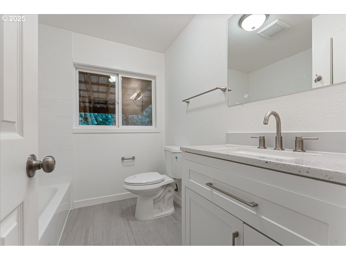 32900 Southeast Colorado Road Sandy, OR 97055 - Photo 15 of 38 a bathroom with a sink a toilet and mirror