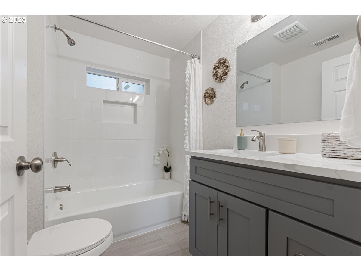 32900 Southeast Colorado Road Sandy, OR 97055 - Photo 16 of 38 a bathroom with a tub sink and mirror