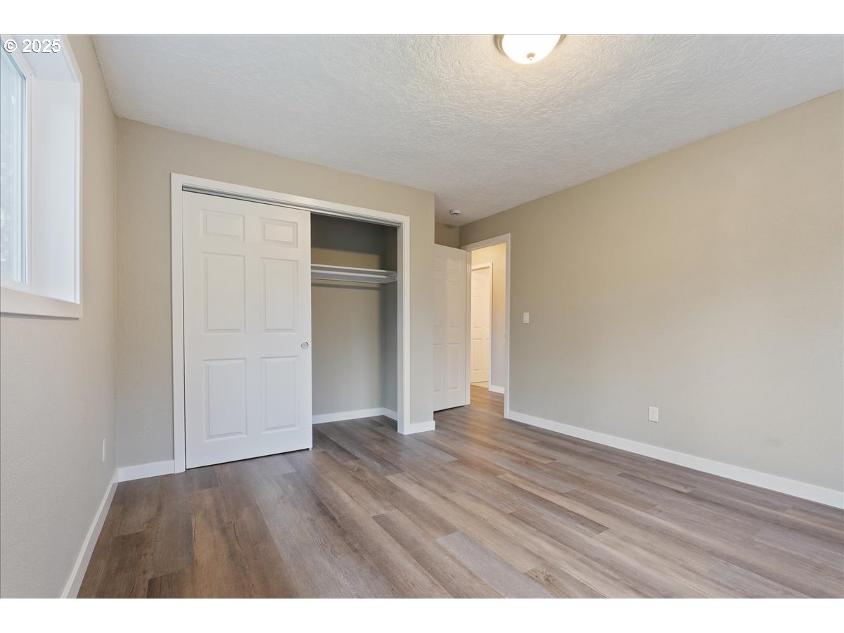 32900 Southeast Colorado Road Sandy, OR 97055 - Photo 19 of 38 a view of an empty room and wooden floor