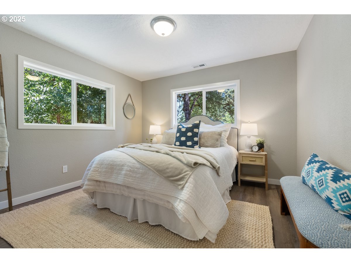 32900 Southeast Colorado Road Sandy, OR 97055 - Photo 20 of 38 a living room with a bed furniture and a window