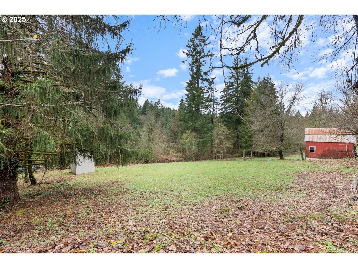 32900 Southeast Colorado Road Sandy, OR 97055 - Photo 29 of 38 a backyard of a house with lots of green space
