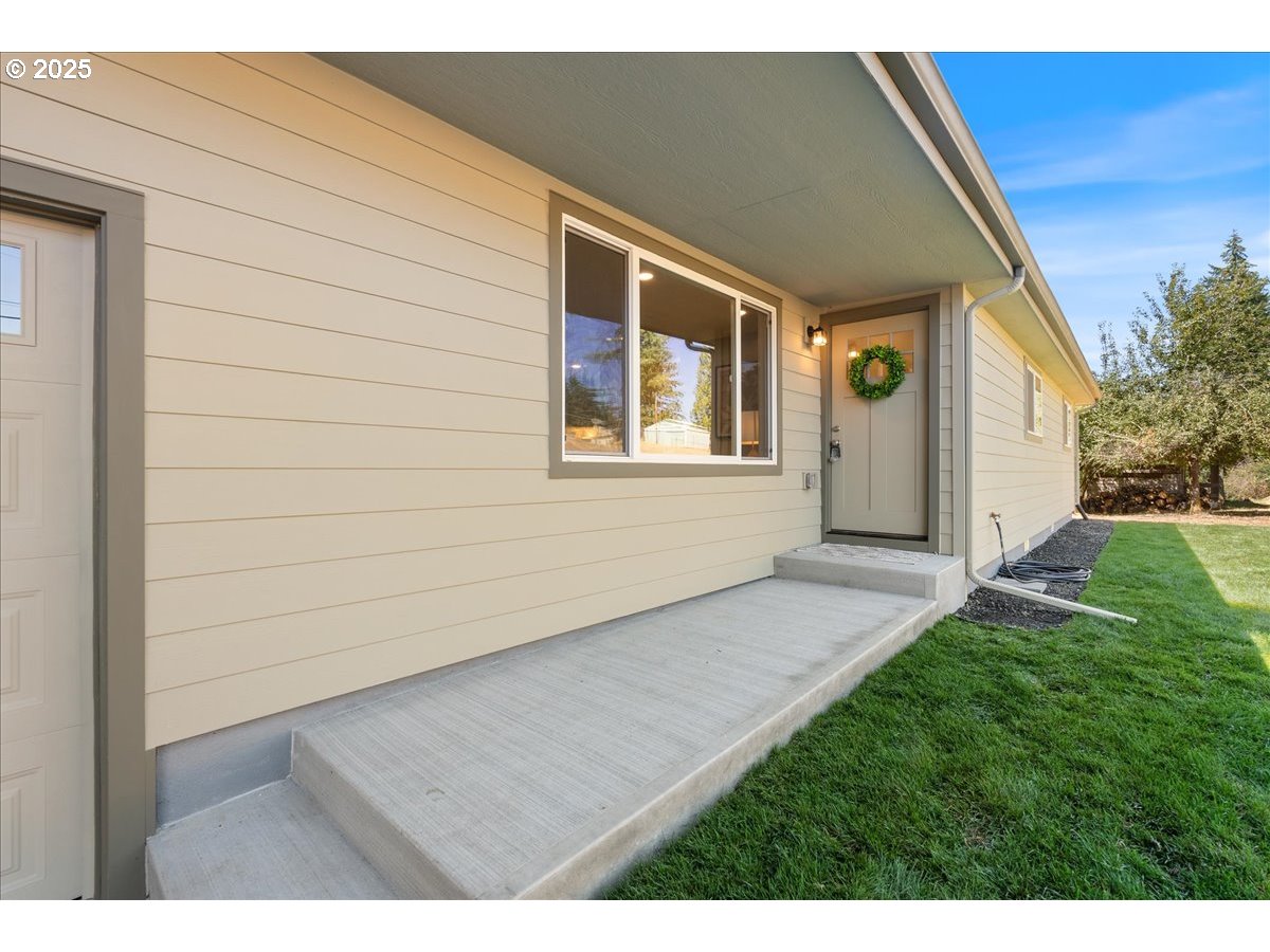32900 Southeast Colorado Road Sandy, OR 97055 - Photo 3 of 38 a view of an house with backyard and garden