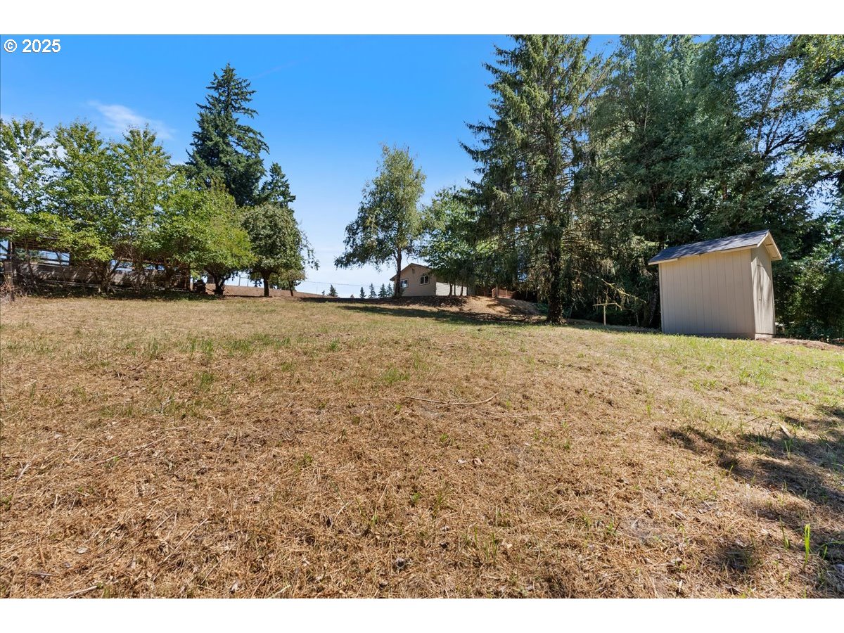 32900 Southeast Colorado Road Sandy, OR 97055 - Photo 35 of 38 a view of a yard with trees in the background