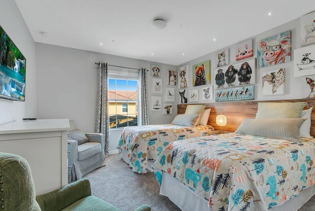 8979 California Palm Road Kissimmee, FL 34747 - Photo 14 of 33 a bedroom with a bed and a couch