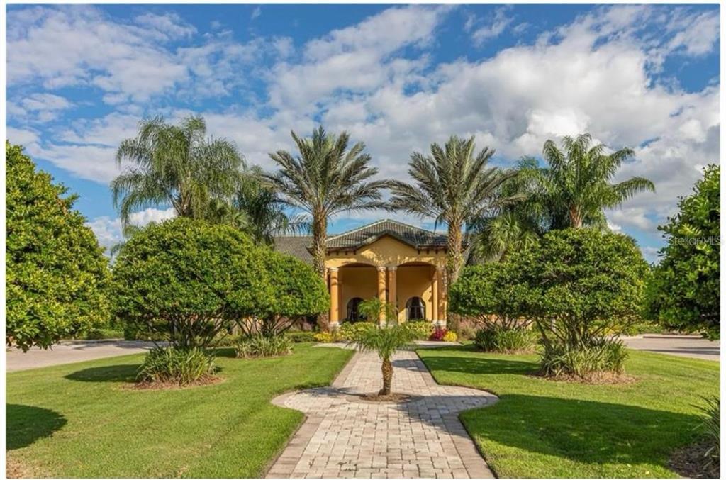 8979 California Palm Road Kissimmee, FL 34747 - Photo 16 of 33 a front view of a house with garden