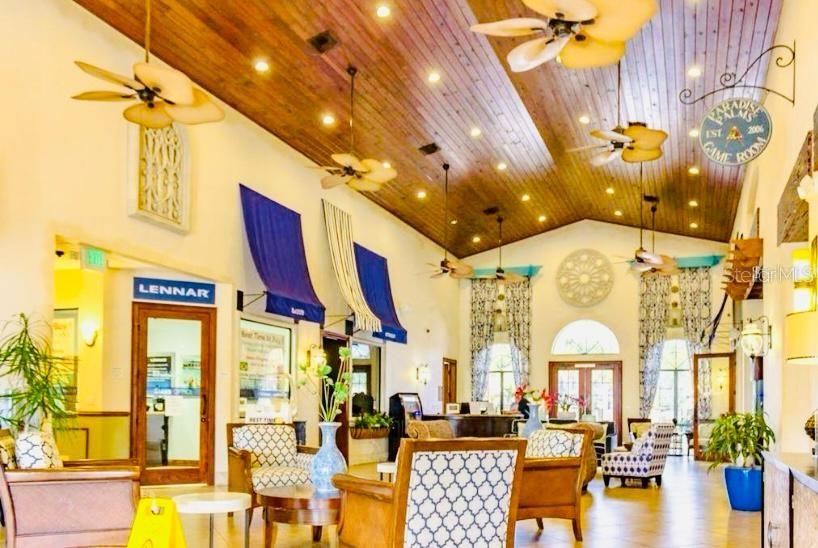 8979 California Palm Road Kissimmee, FL 34747 - Photo 20 of 33 a living room with lots of furniture and a chandelier