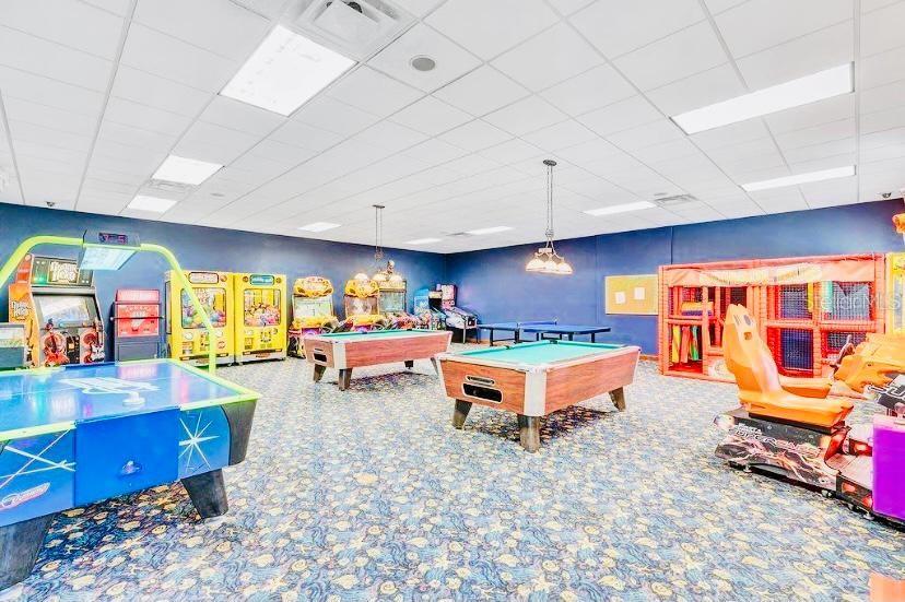 8979 California Palm Road Kissimmee, FL 34747 - Photo 21 of 33 a living room with furniture and a flat screen tv