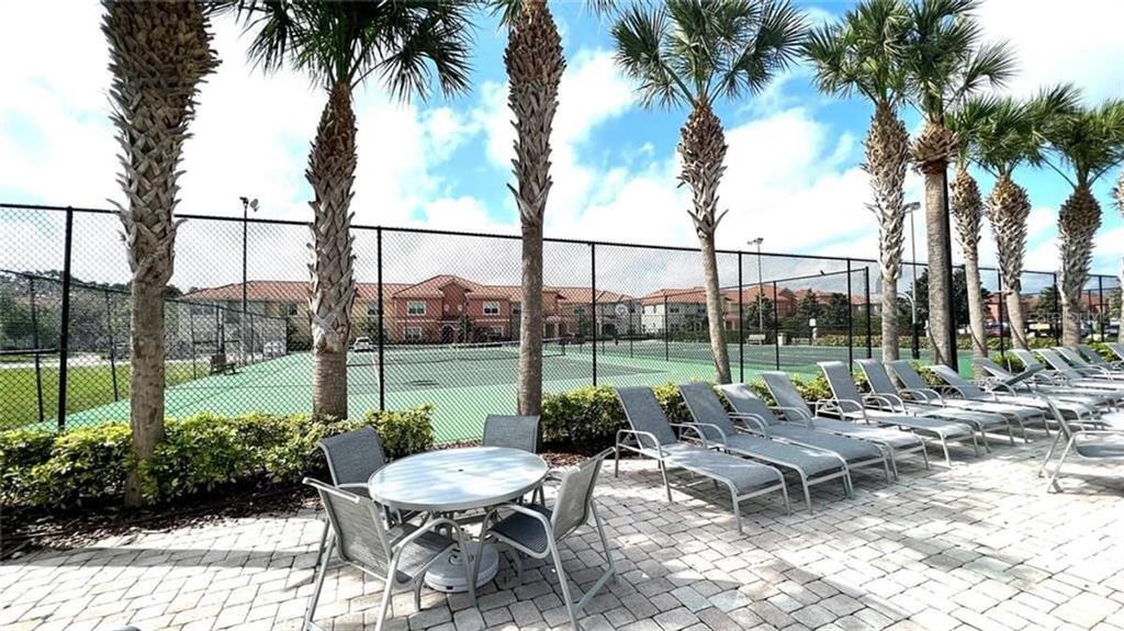 8979 California Palm Road Kissimmee, FL 34747 - Photo 28 of 33 a view of a backyard with a patio and swimming pool