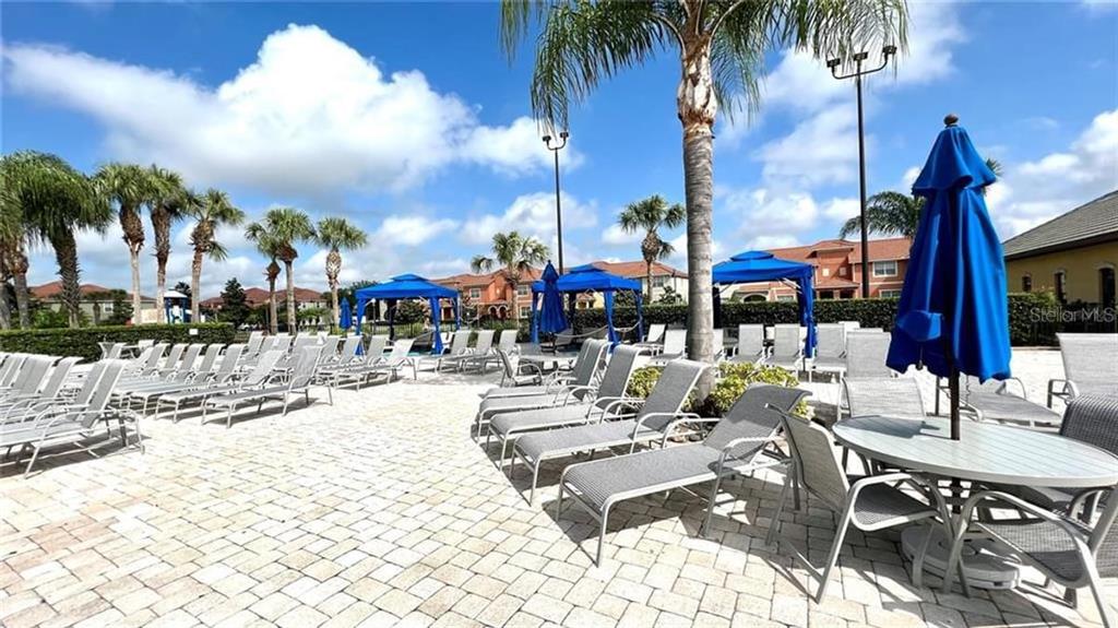 8979 California Palm Road Kissimmee, FL 34747 - Photo 29 of 33 a view of a patio with swimming pool