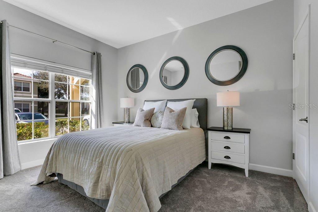 8979 California Palm Road Kissimmee, FL 34747 - Photo 7 of 33 a bedroom with a bed and window
