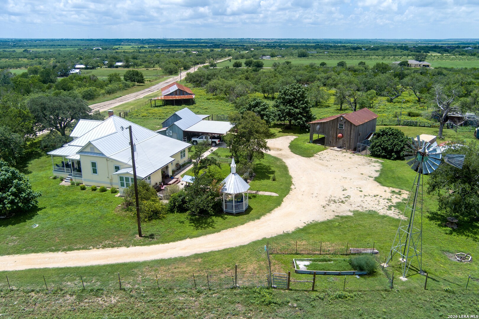 4515 Stapper Road St. Hedwig, TX 78152 - Photo 50 of 64 a view of a garden with a building in the background