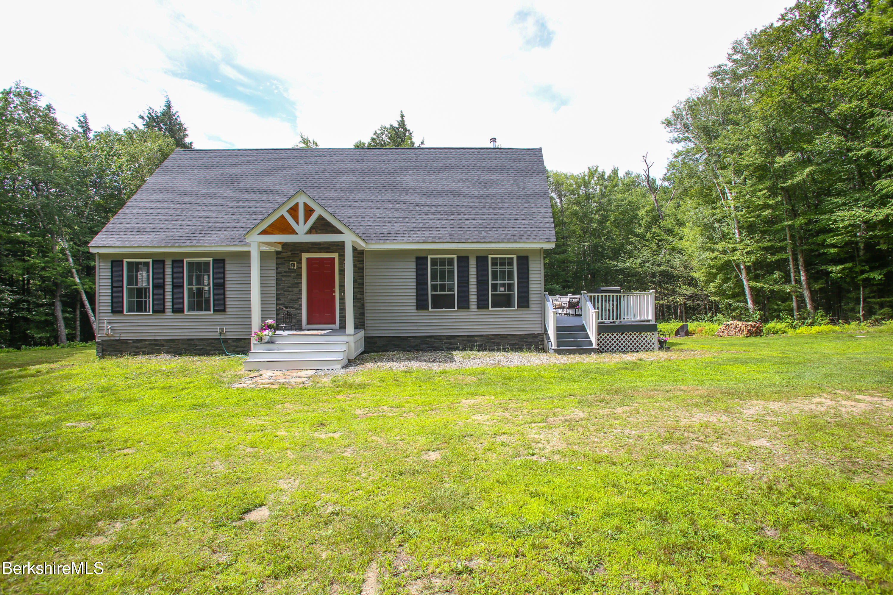 201 Ford Hill Road Rowe, MA 01367 - Photo 2 of 34 a front view of a house with a garden