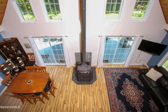 view of living room with furniture and floor to ceiling windows