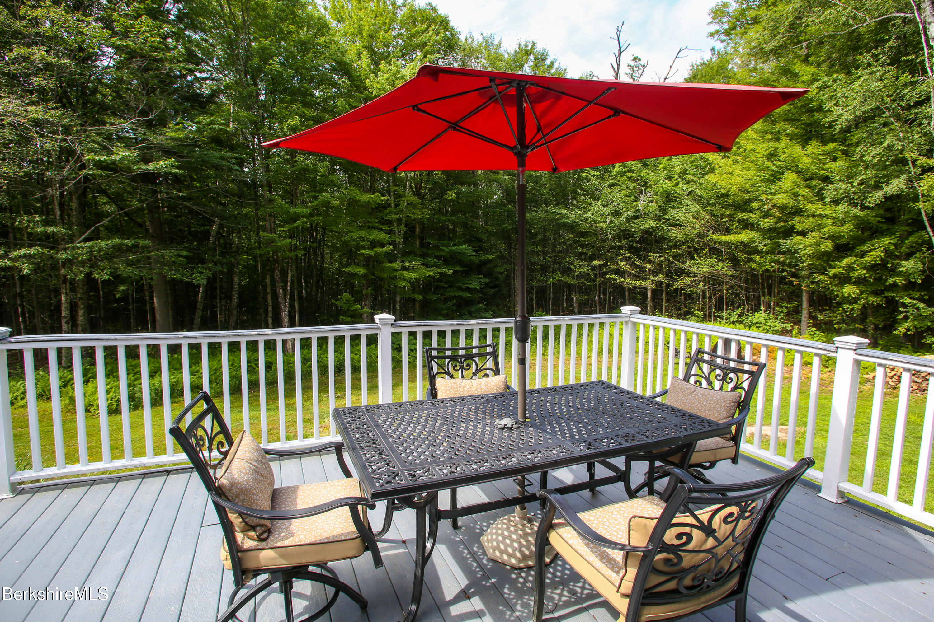 201 Ford Hill Road Rowe, MA 01367 - Photo 24 of 34 a view of a balcony with a table and chairs