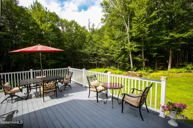 a view of a wooden deck with furniture