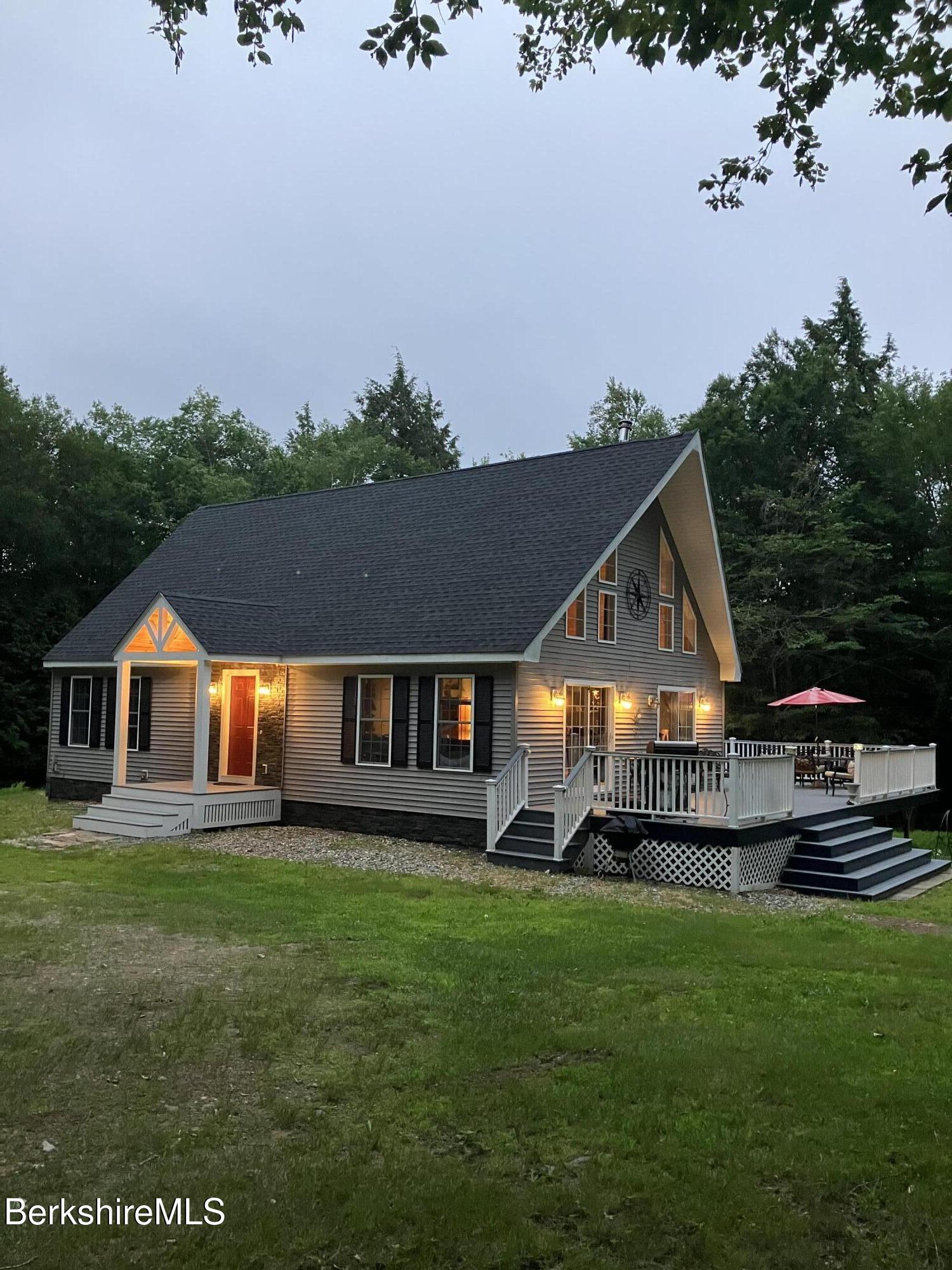 201 Ford Hill Road Rowe, MA 01367 - Photo 32 of 34 a front view of a house with a garden and trees