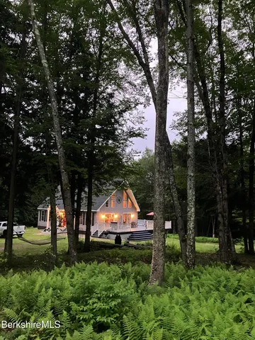 a backyard of a house with lots of green space