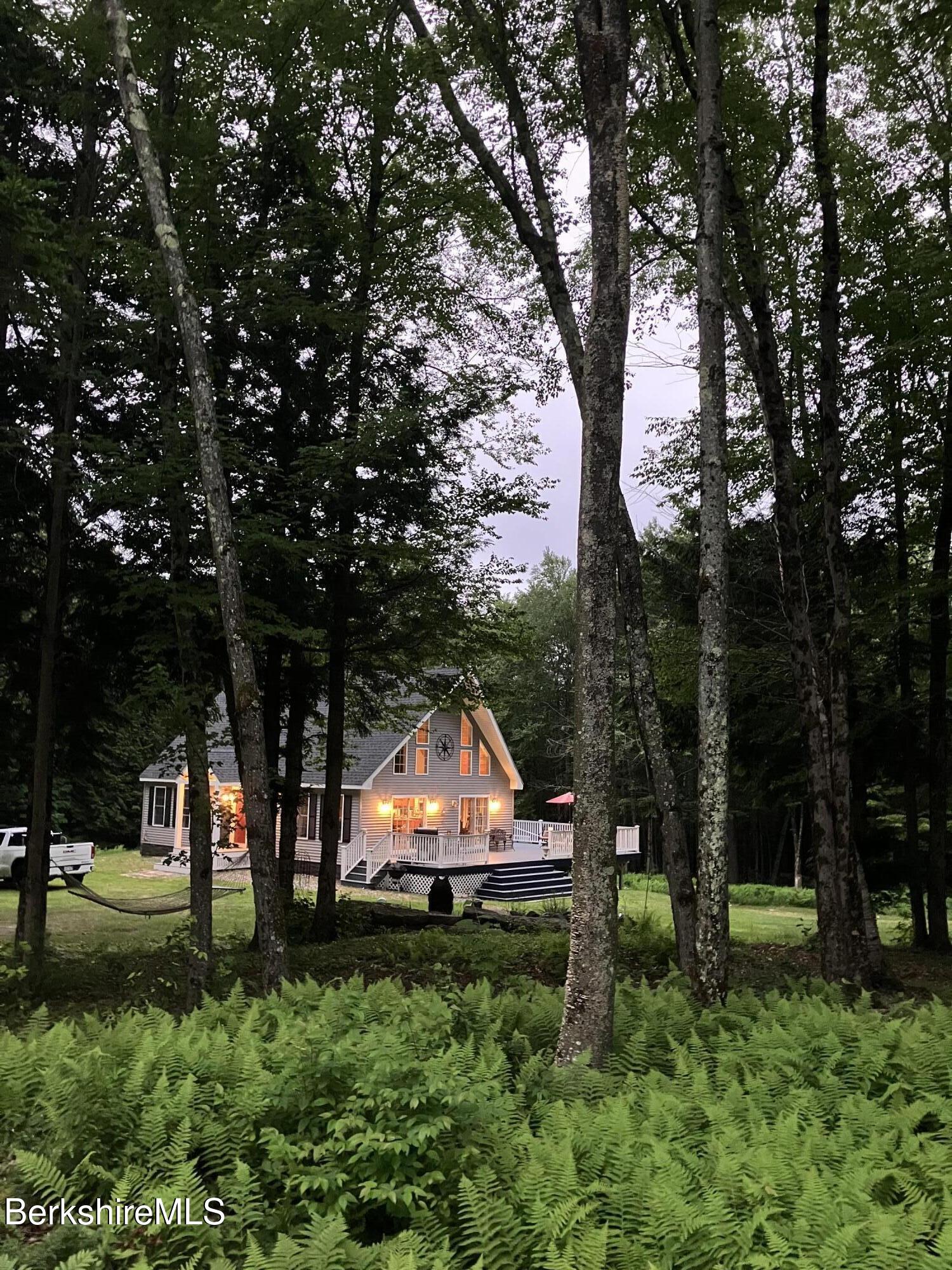 201 Ford Hill Road Rowe, MA 01367 - Photo 33 of 34 a backyard of a house with lots of green space