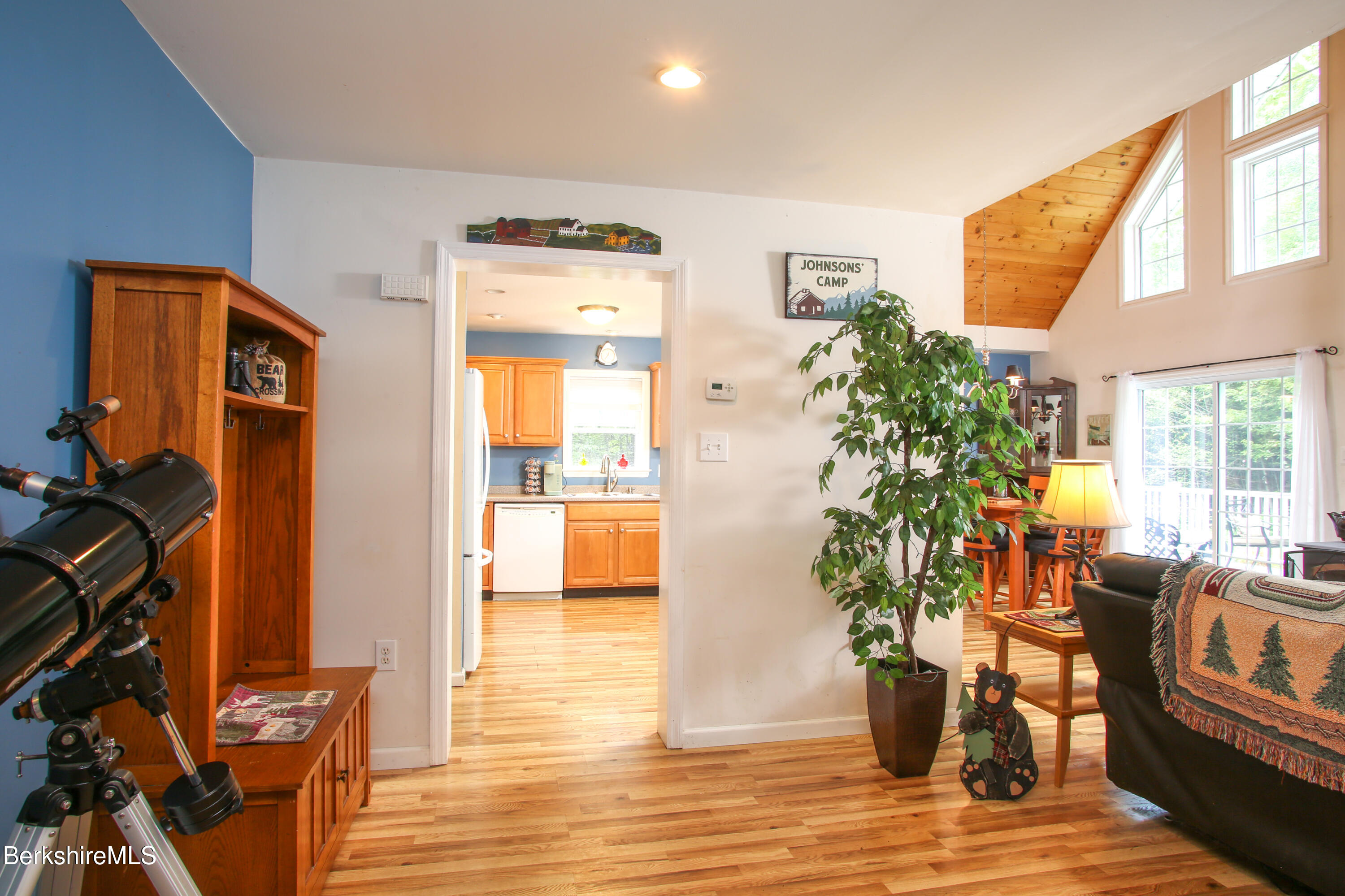 201 Ford Hill Road Rowe, MA 01367 - Photo 10 of 34 a living room with furniture floor to ceiling window and wooden floor