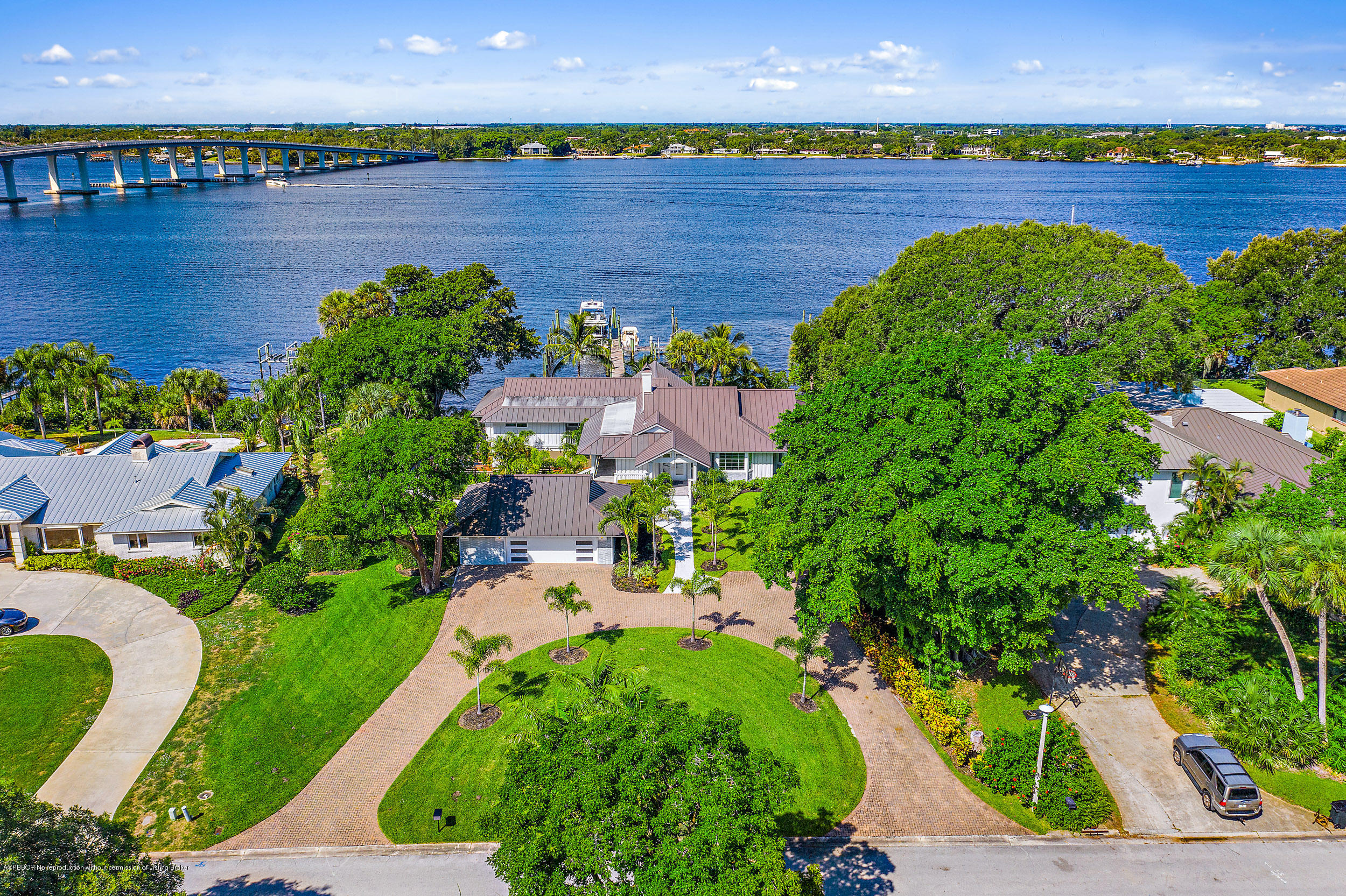19 North River Road Sewall's Point, FL 34996 - Photo 2 of 51 an aerial view of a residential houses with outdoor space and lake view