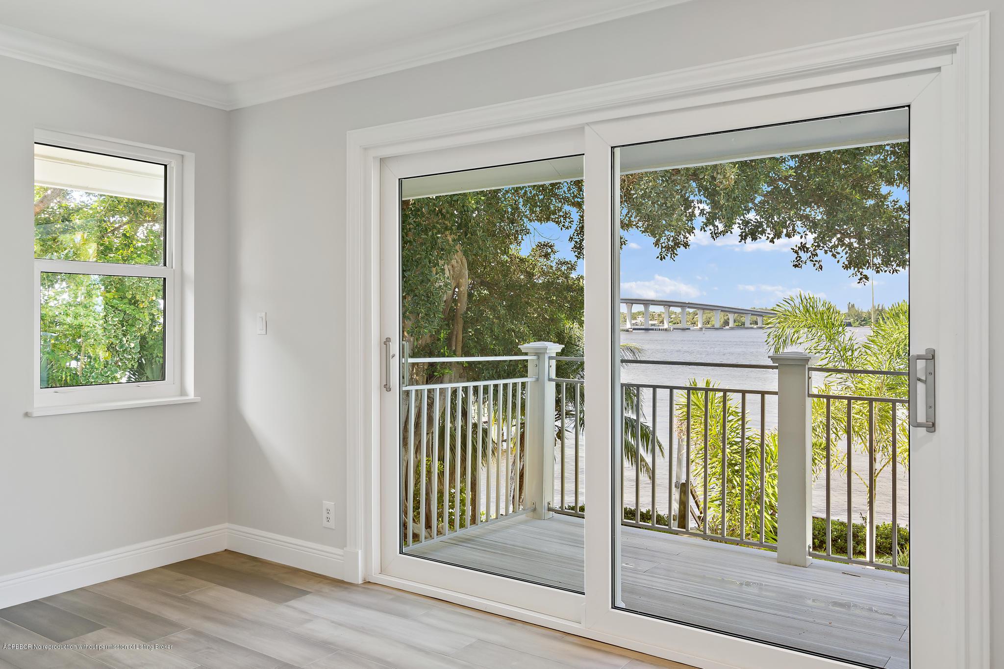 19 North River Road Sewall's Point, FL 34996 - Photo 23 of 51 a view of a glass door with a tree on the side