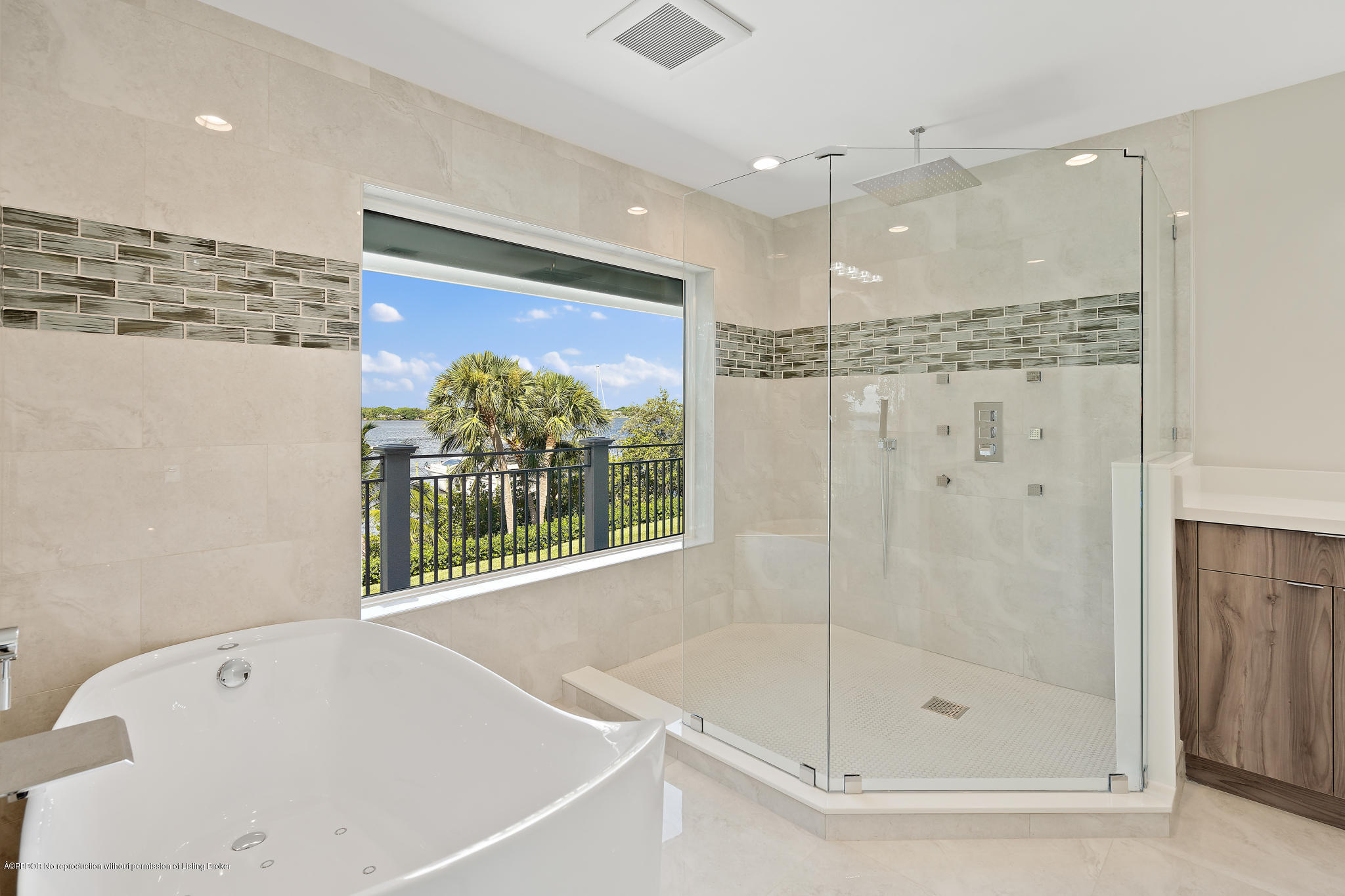 19 North River Road Sewall's Point, FL 34996 - Photo 26 of 51 a bathroom with a bathtub and a shower