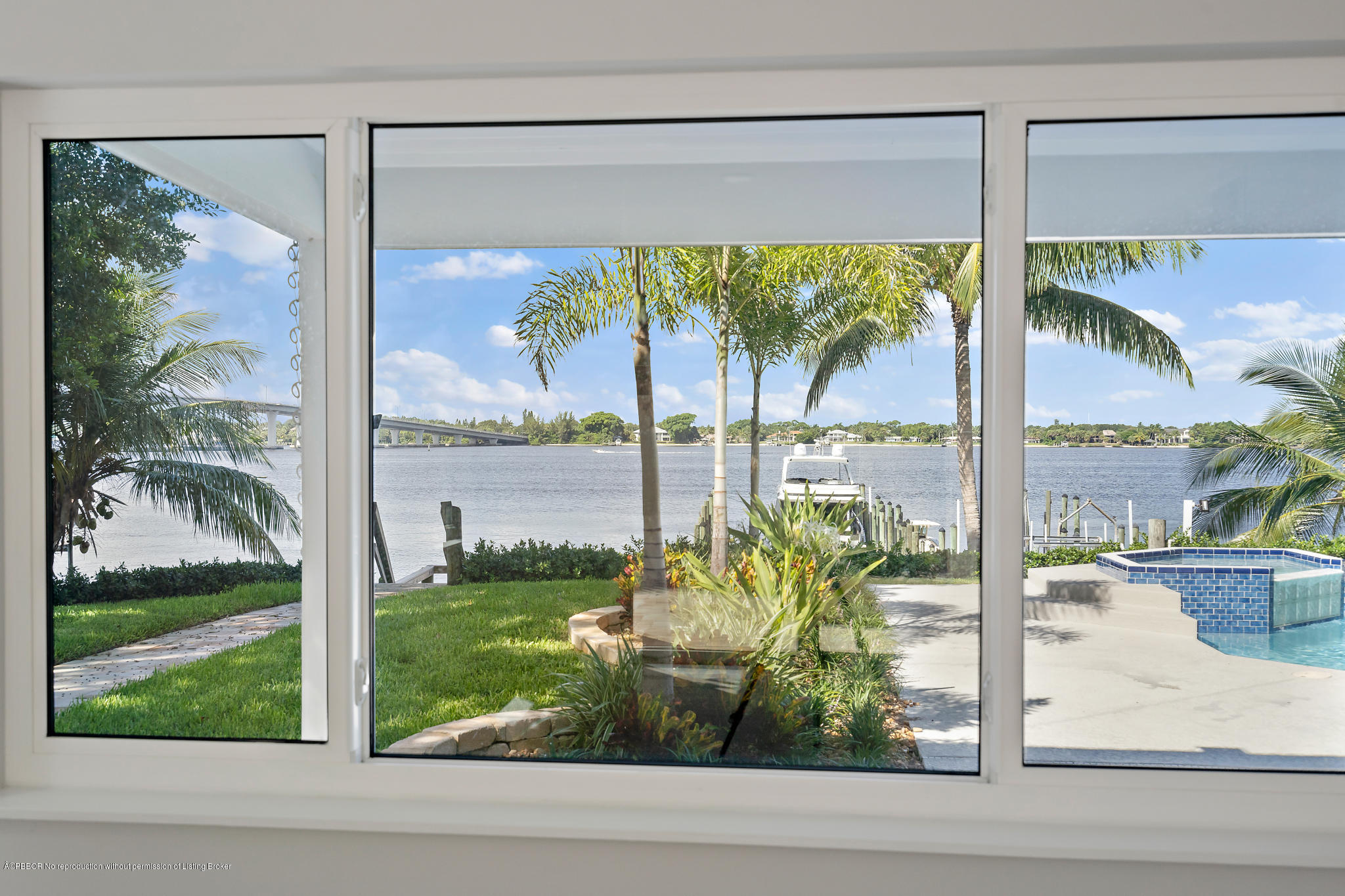 19 North River Road Sewall's Point, FL 34996 - Photo 45 of 51 a view of a porch with a floor to ceiling windows and yard