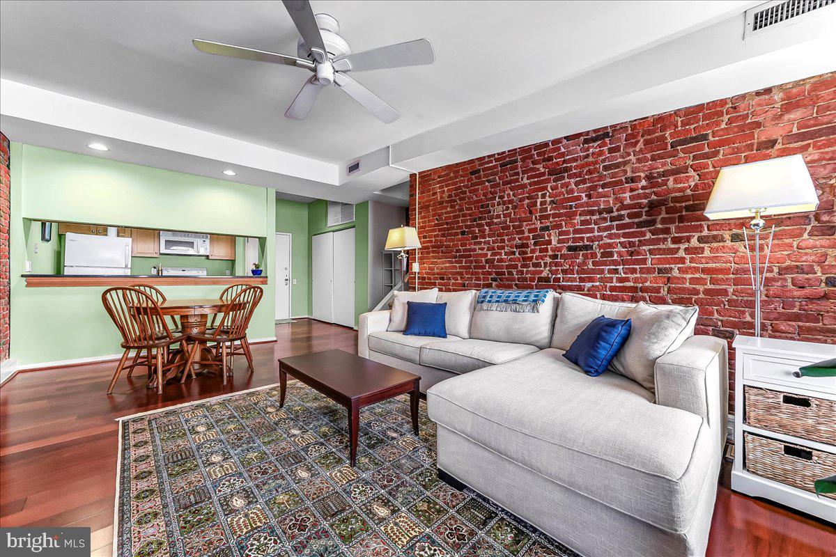 102 Church Street, Unit 402 Philadelphia, PA 19106 - Photo 4 of 24 a living room with furniture and a rug