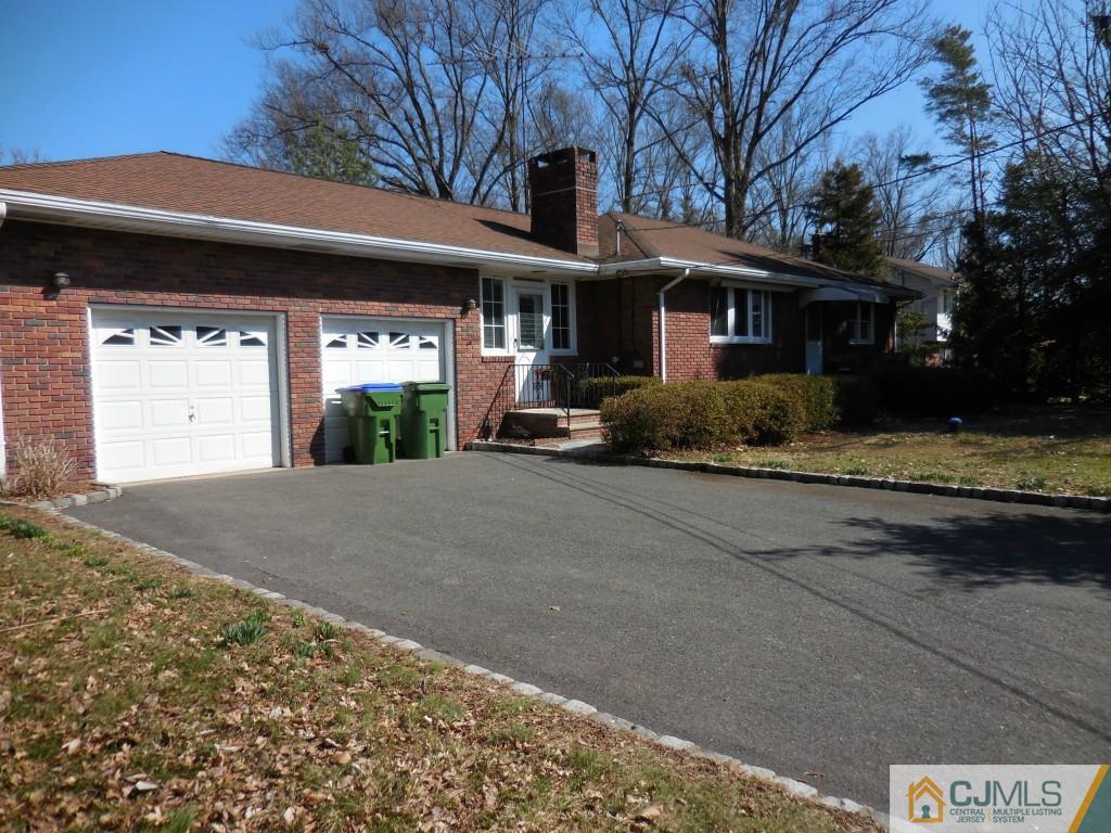 578 Darwin Boulevard Edison, NJ 08820 - Photo 1 of 20 a front view of a house with a yard