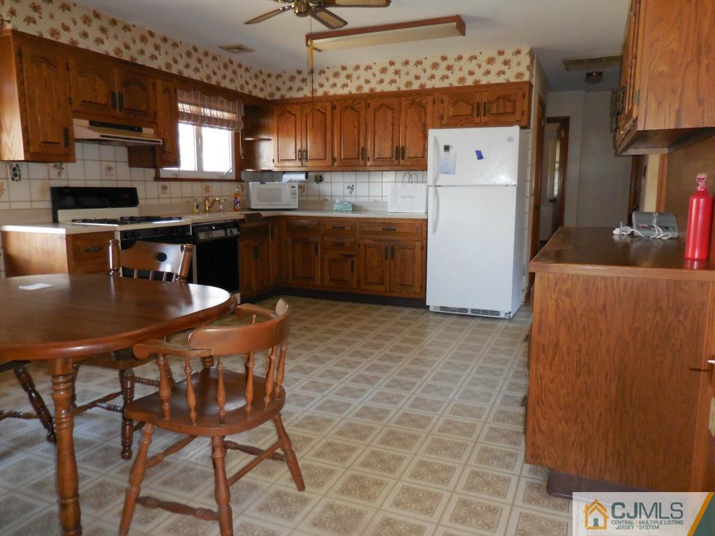 578 Darwin Boulevard Edison, NJ 08820 - Photo 5 of 20 a kitchen with stainless steel appliances a stove a sink dishwasher and a refrigerator