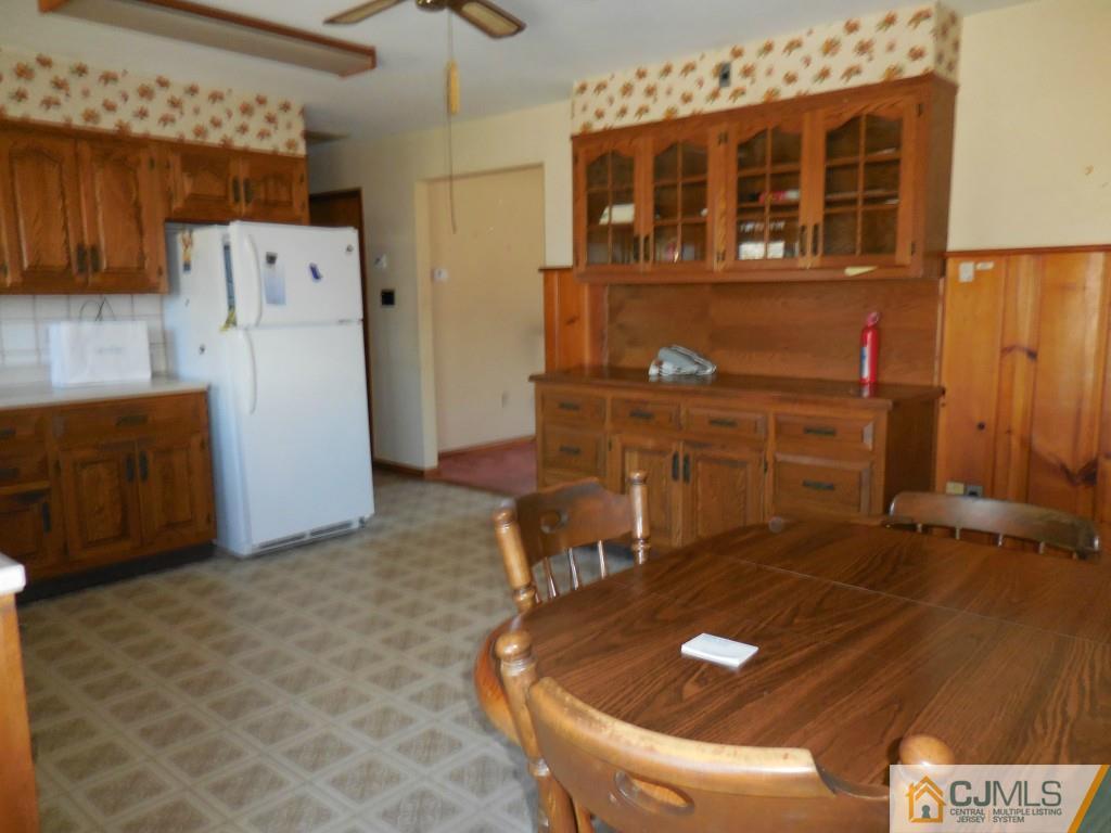 578 Darwin Boulevard Edison, NJ 08820 - Photo 6 of 20 a bathroom with a sink and a refrigerator