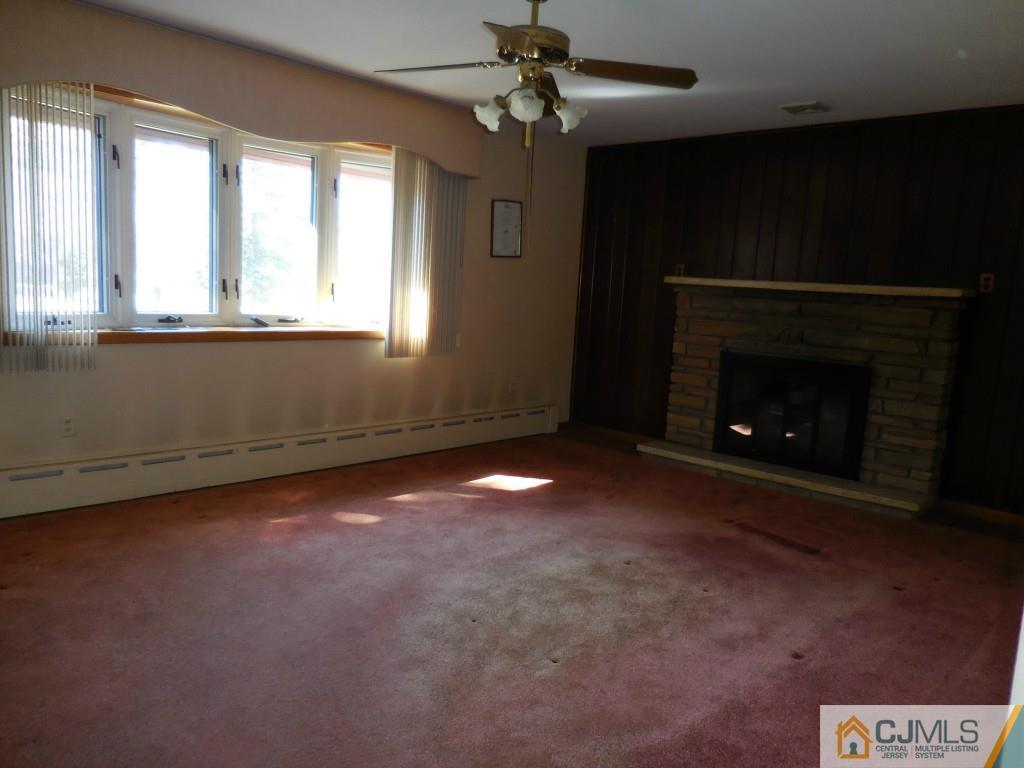 578 Darwin Boulevard Edison, NJ 08820 - Photo 8 of 20 a view of an empty room with a fireplace